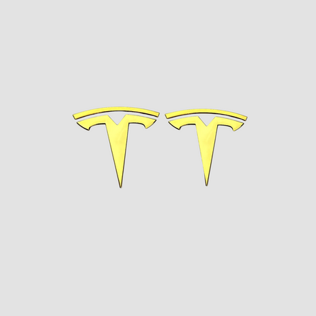 To Tesla T-emblemer i guldfarvet metal til Tesla Model 3