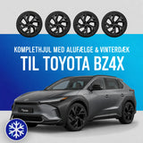 18" komplethjul med sorte alufælge og vinterdæk til Toyota bZ4X – fire hjul vist over en grå bZ4X
