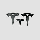 Tre Tesla T-emblem covers i blank sort i forskellige størrelser til Model 3
