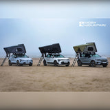 Moby Mountain Peak XL tagtelt til 3 personer i alle tre farver monteret på elbiler på stranden