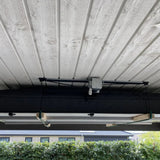 Moby Mountain telt lift med tagtelt opbevaret under loftet i carport